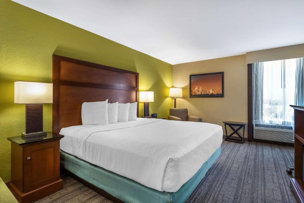 a hotel room with a large bed and a window at Best Western Plus Houston Energy Corridor in Houston