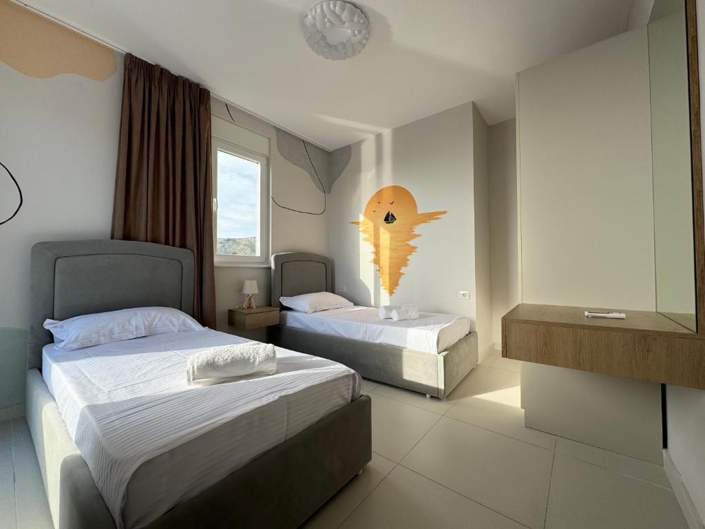 Postel nebo postele na pokoji v ubytování R Apartments