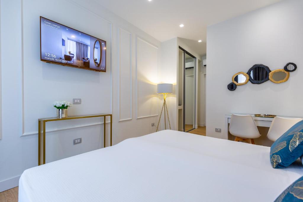 Postel nebo postele na pokoji v ubytování Casa Lounge Costituzione