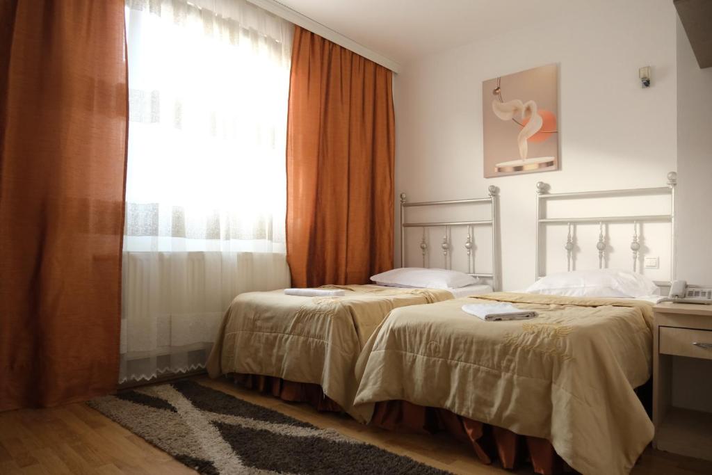 Postel nebo postele na pokoji v ubytování Hotel Sara & SPA