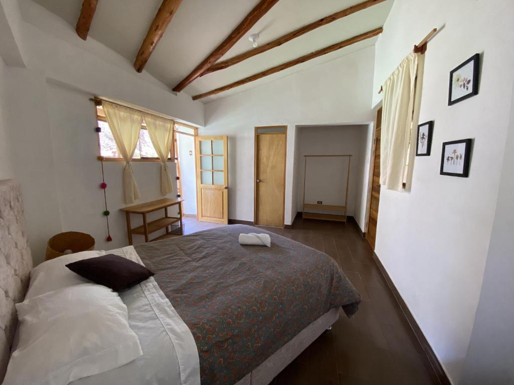 Postel nebo postele na pokoji v ubytování Colibri Wasi Pisac