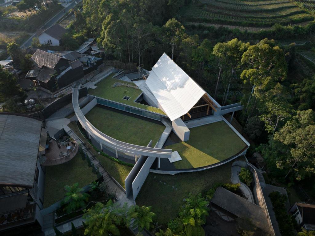 an aerial view of a house with a roof at Sunsetfalls Gardens and Resort in Magelang