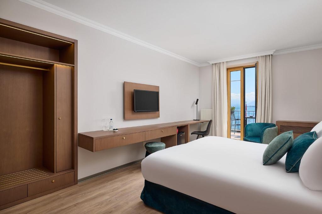 Postel nebo postele na pokoji v ubytování Hotel Le Rive