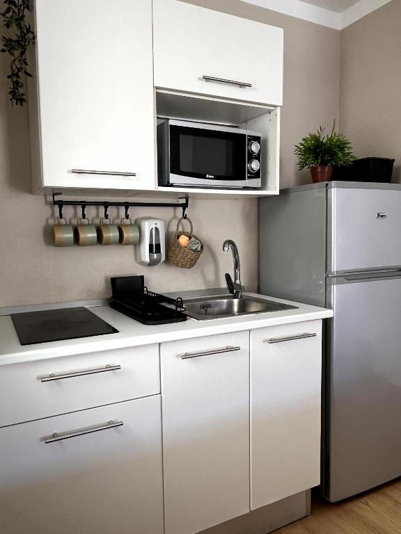 Kuchyň nebo kuchyňský kout v ubytování Casa4You 110 - With heated pool, city and partial sea views