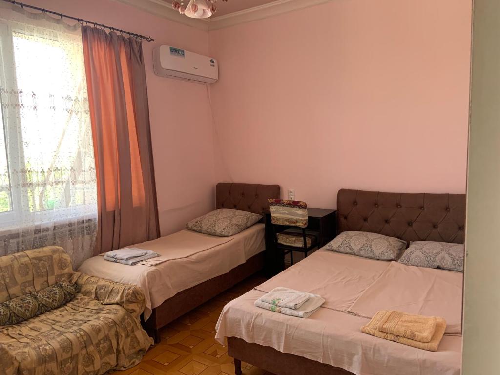 Postel nebo postele na pokoji v ubytování Guest House Lilia