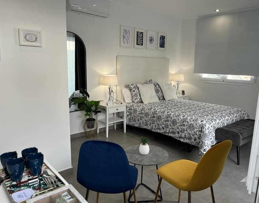 En eller flere senge i et værelse på XVII A Suite Apartamentos Morales & Arnal