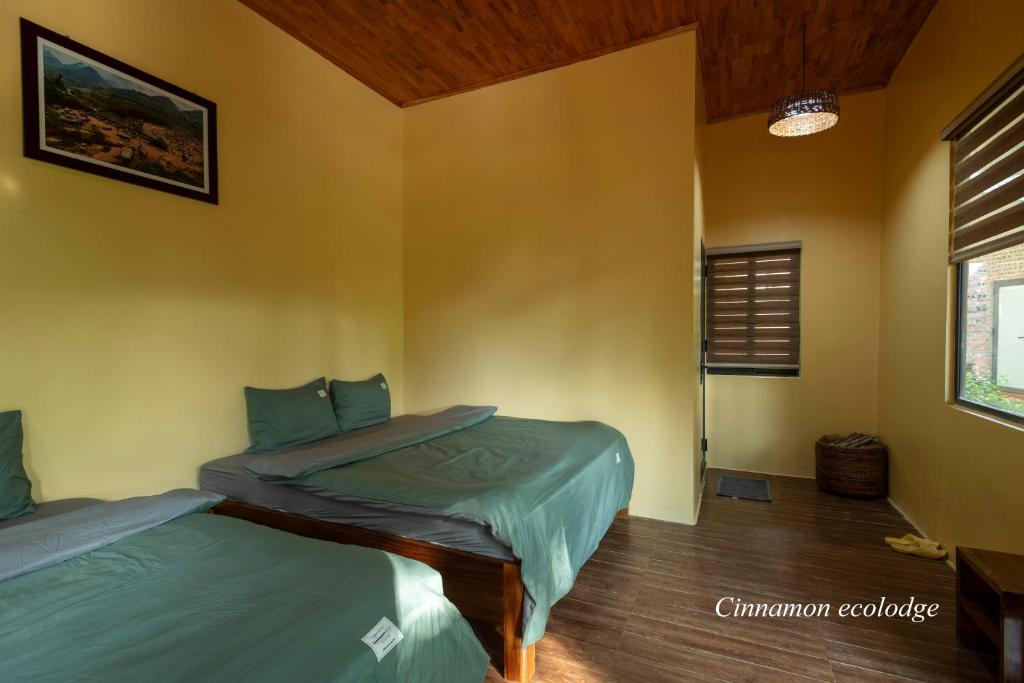 Postel nebo postele na pokoji v ubytování Cinnamon Eco Lodge