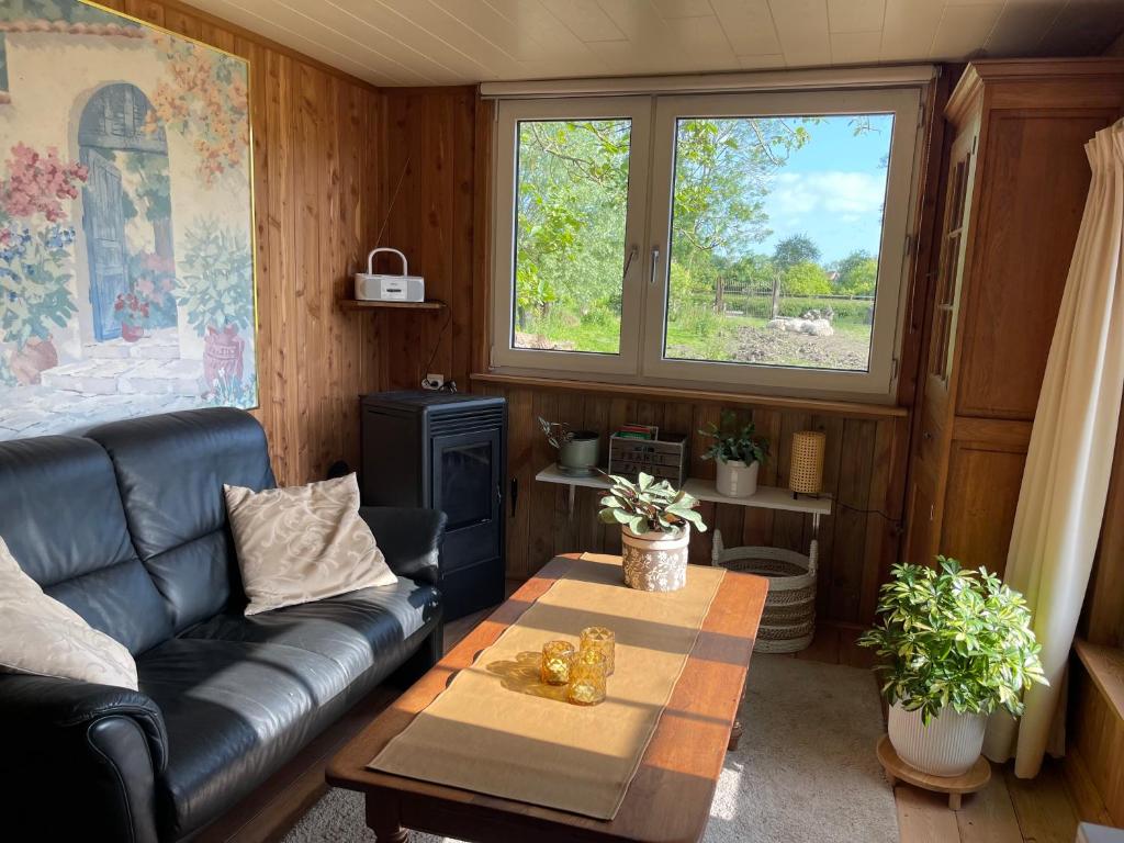 Area soggiorno di Uniek Tiny house nabij de kust in mooie polders