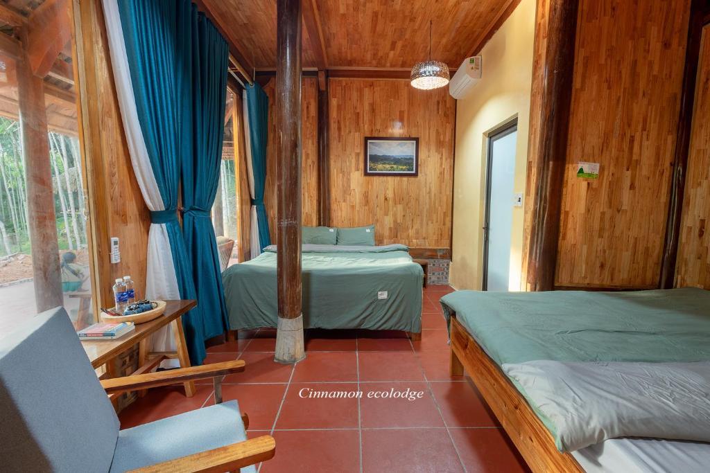 Postel nebo postele na pokoji v ubytování Cinnamon Eco Lodge