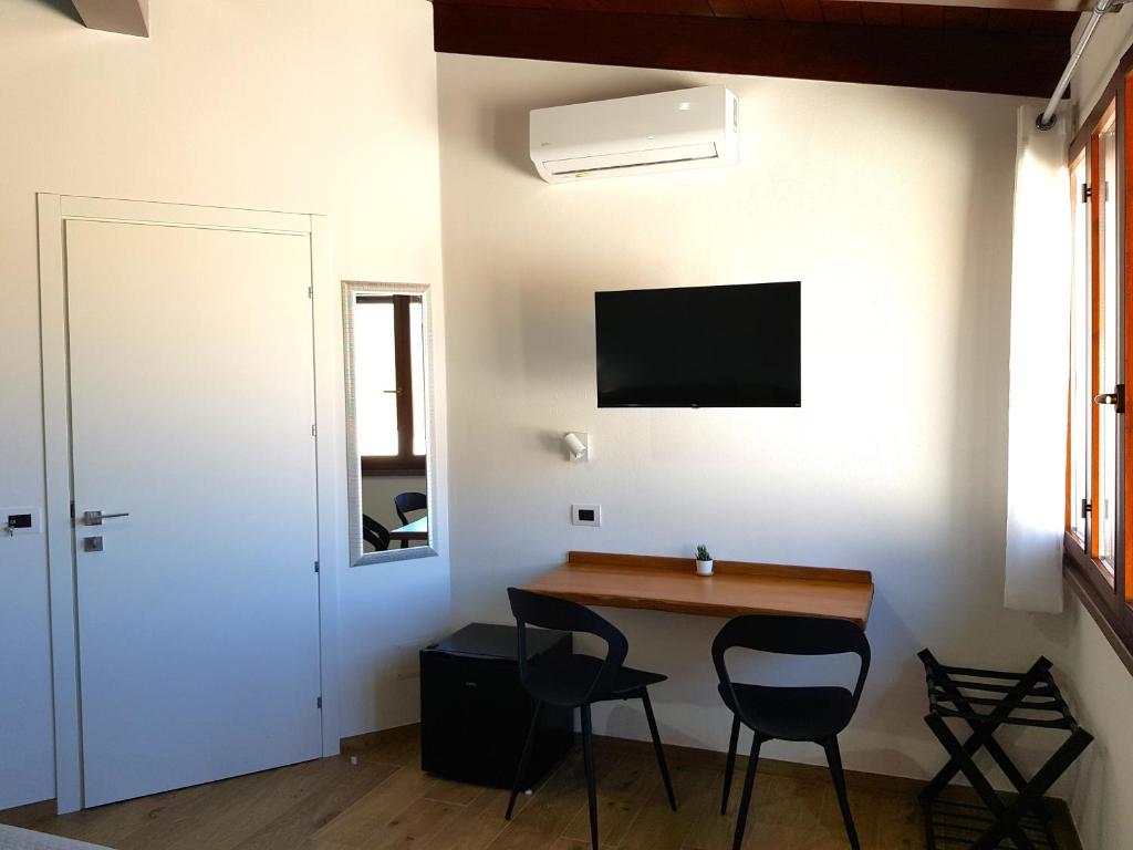 TV a/nebo společenská místnost v ubytování Nova Rooms