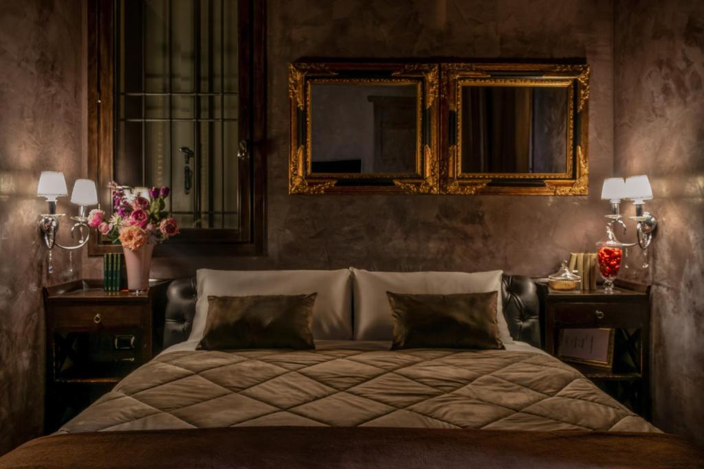 Postel nebo postele na pokoji v ubytování Dolce Casa SUITE Villa Laura
