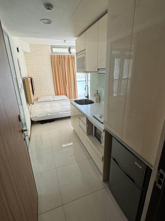Postel nebo postele na pokoji v ubytování Tianmu Star Urban Living