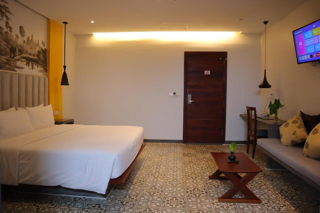 Postel nebo postele na pokoji v ubytování Siem Reap Palace Hotel & Spa