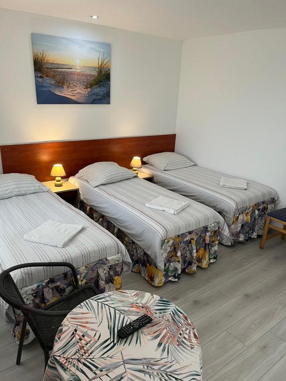 Postel nebo postele na pokoji v ubytování Stilo Hotel
