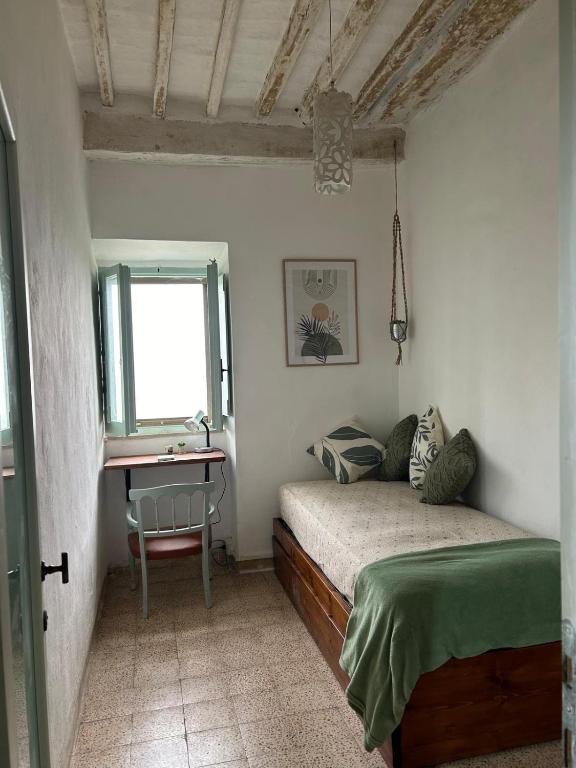 Postel nebo postele na pokoji v ubytování La Casetta di Nonno Mario