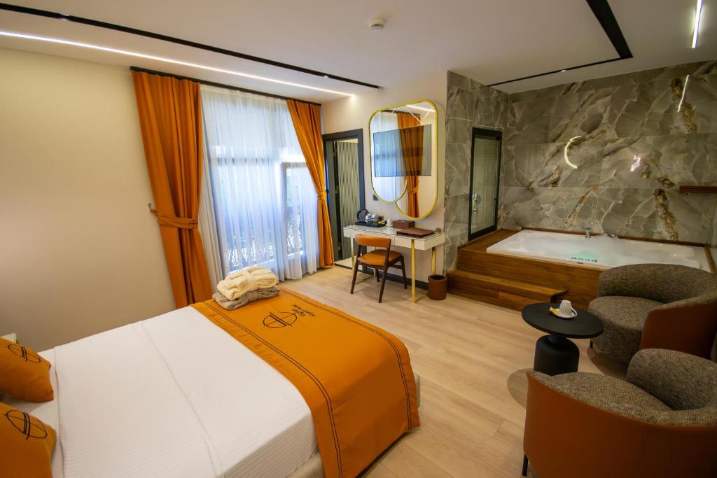 Letto o letti in una camera di Elysian Airport Hotel