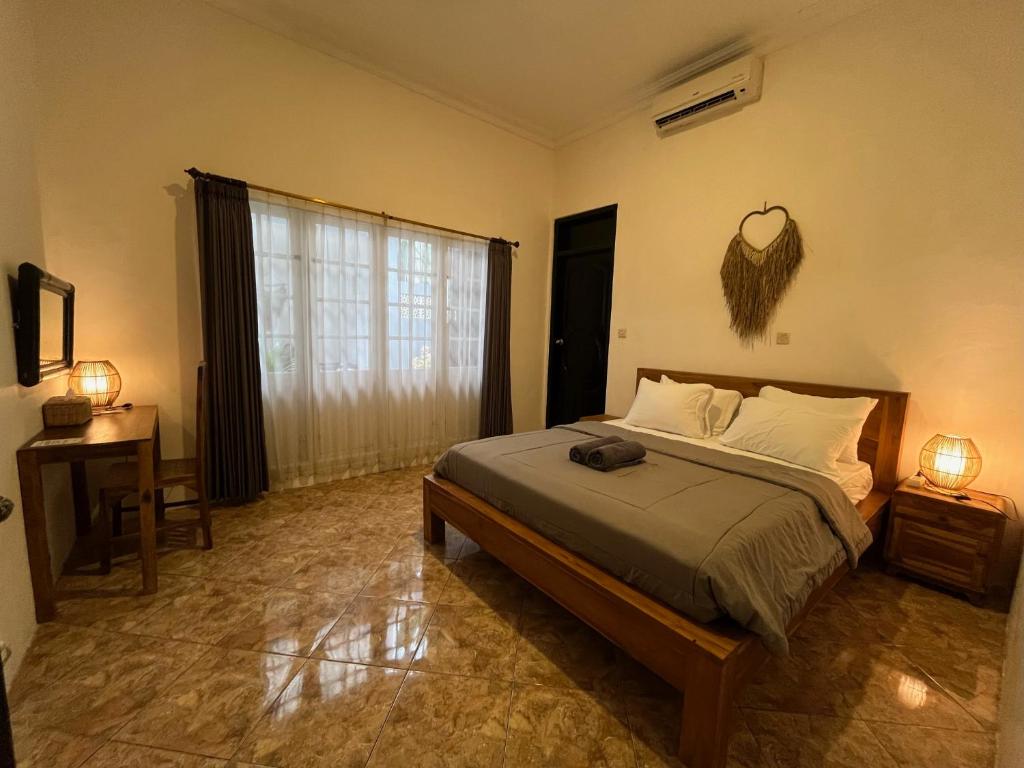 Postel nebo postele na pokoji v ubytování ODA Guest House Ubud