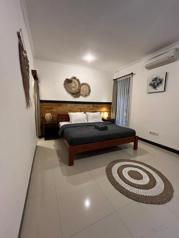 Postel nebo postele na pokoji v ubytování ODA Guest House Ubud