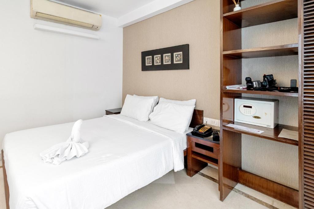 Postel nebo postele na pokoji v ubytování Hotel Casa Fortuna