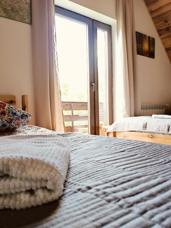 Posteľ alebo postele v izbe v ubytovaní Kyczyrka