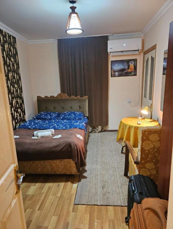 Postel nebo postele na pokoji v ubytování Buddha apartment