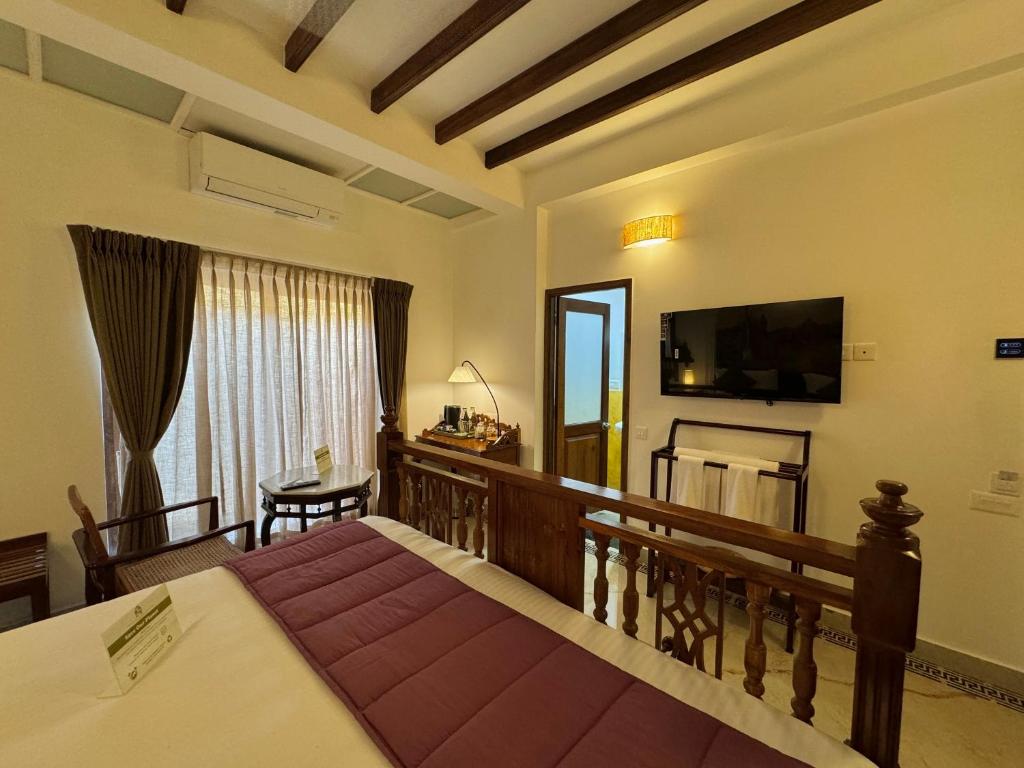 TV a/nebo společenská místnost v ubytování La Plage Seaview Suites