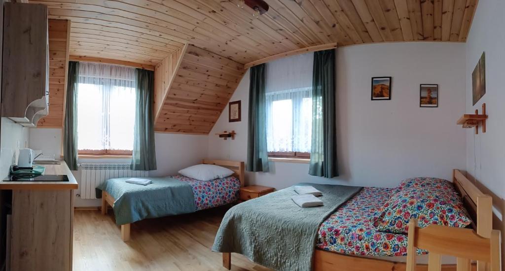 Posteľ alebo postele v izbe v ubytovaní Kyczyrka
