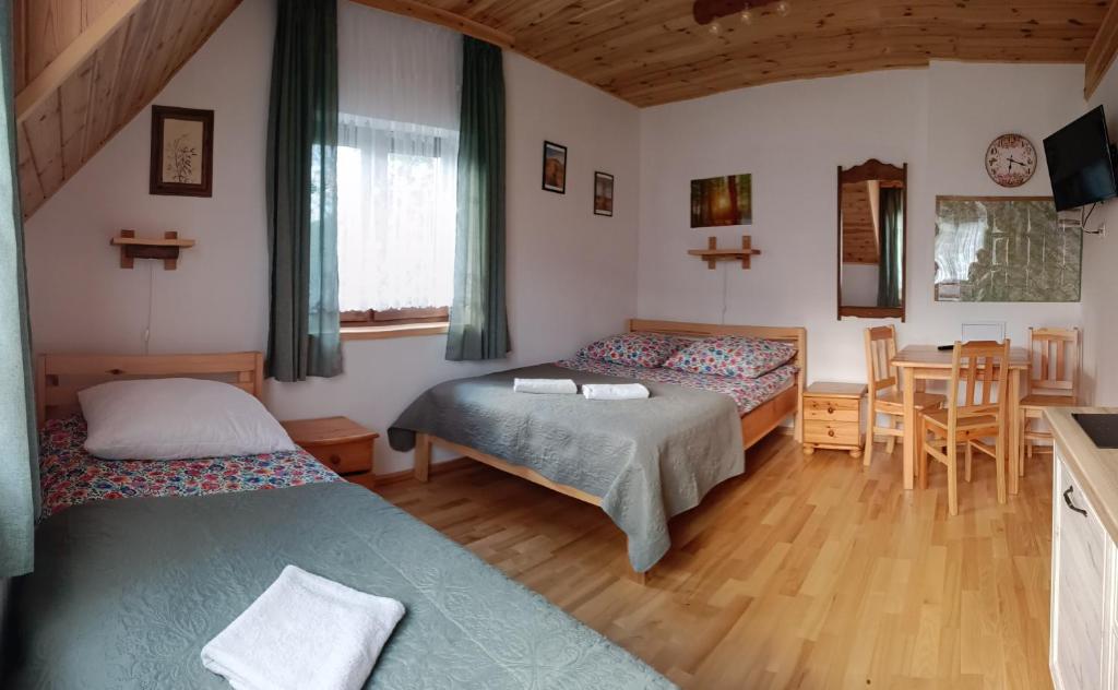 Posteľ alebo postele v izbe v ubytovaní Kyczyrka