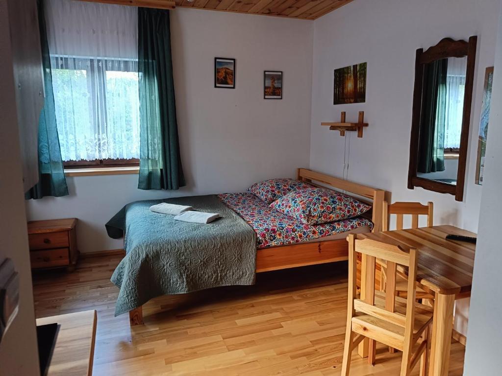 Posteľ alebo postele v izbe v ubytovaní Kyczyrka
