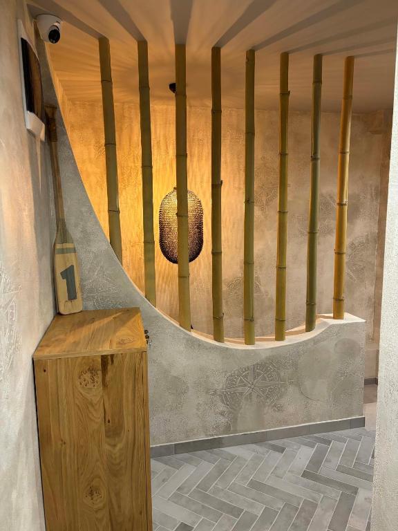 a spiral staircase with a glass bottle on the floor at Casa Mint in Sozopol