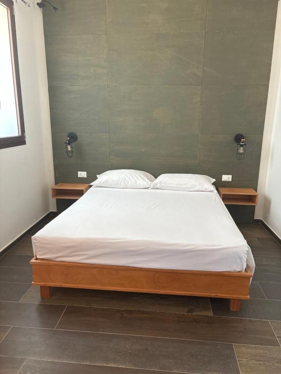 Postel nebo postele na pokoji v ubytování RUDINI' CHARMING ROOM