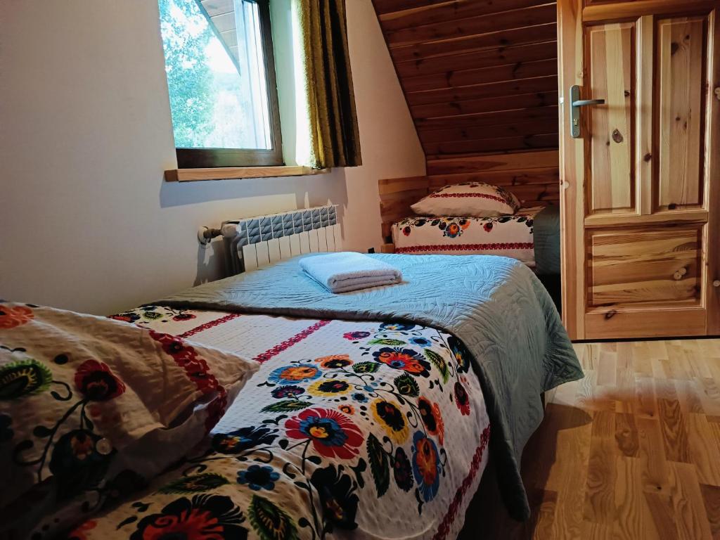 Posteľ alebo postele v izbe v ubytovaní Kyczyrka