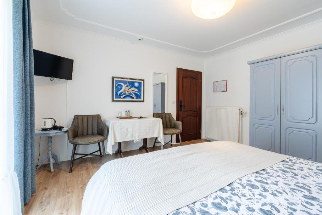 Postel nebo postele na pokoji v ubytování Hotel Steineweiher