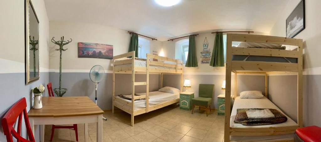 Postel nebo postele na pokoji v ubytování Nomado Hostel