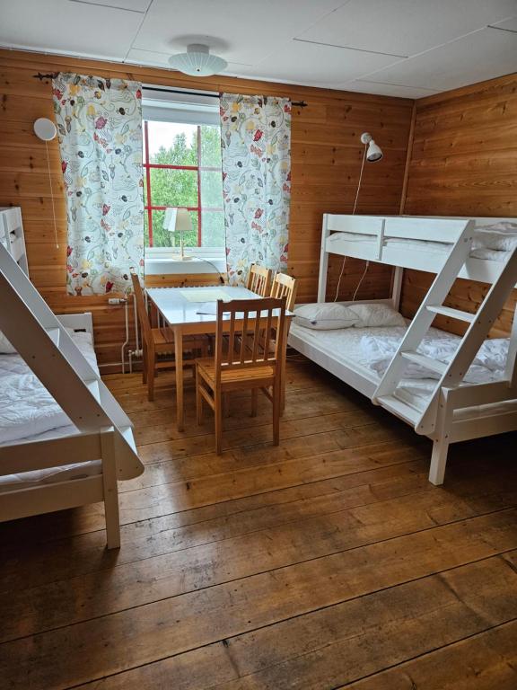 Postel nebo postele na pokoji v ubytování Idrefjällens Sport Hostel
