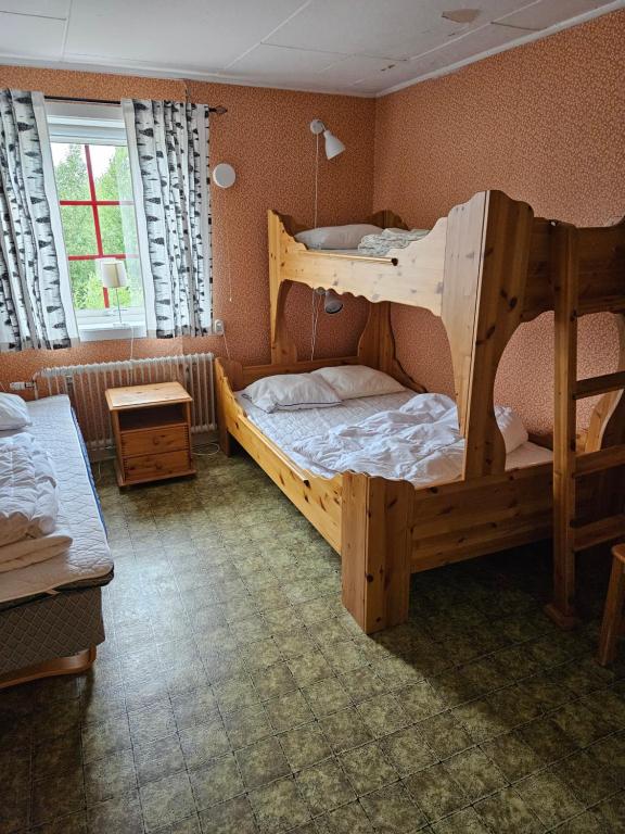 Postel nebo postele na pokoji v ubytování Idrefjällens Sport Hostel