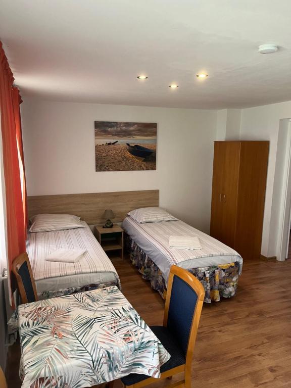 Postel nebo postele na pokoji v ubytování Stilo Hotel