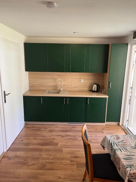 Kuchyň nebo kuchyňský kout v ubytování Stilo Hotel