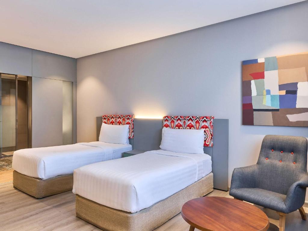 Postel nebo postele na pokoji v ubytování Ibis Styles Dubai Jumeira