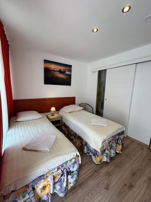 Postel nebo postele na pokoji v ubytování Stilo Hotel