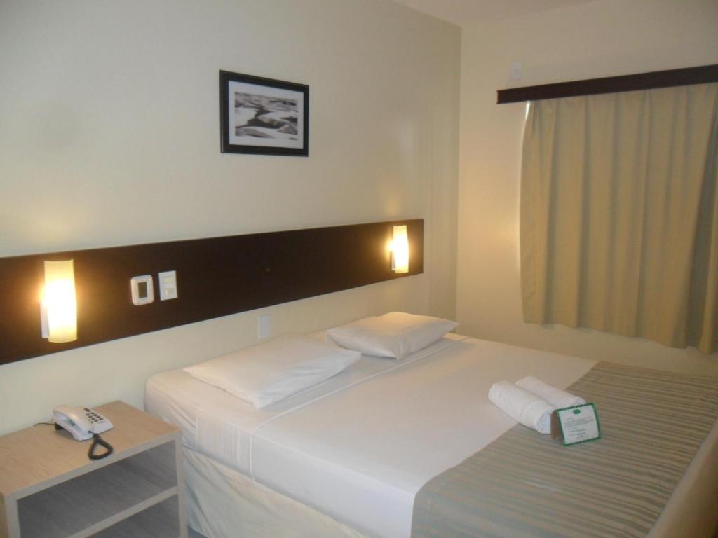Postel nebo postele na pokoji v ubytování Hotel Premier