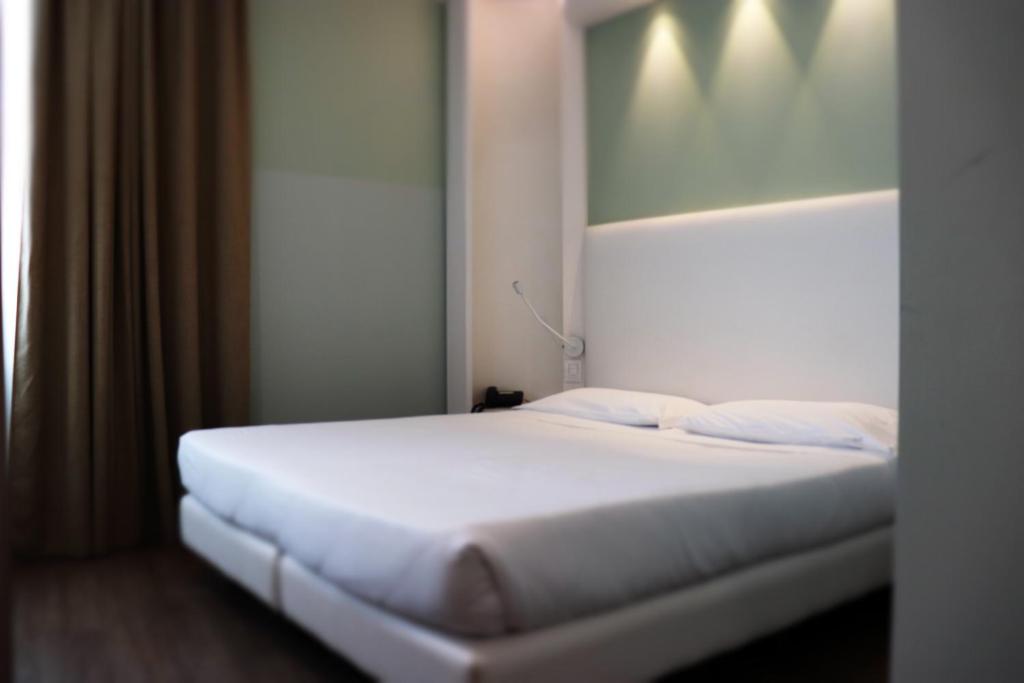 Postel nebo postele na pokoji v ubytování Ark Hotel