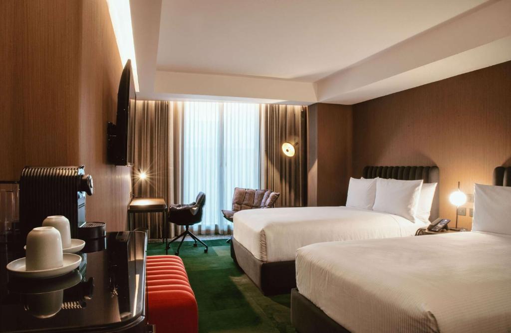 Voodi või voodid majutusasutuse Doubletree By Hilton Lima San Isidro toas