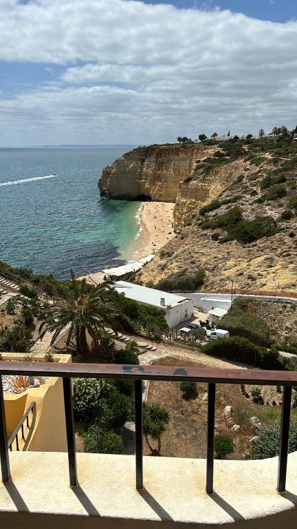 a view of a beach and the ocean from a balcony at Jupiter Sweet Apartments - Algarve - Praia Vale centeanes in Lagoa