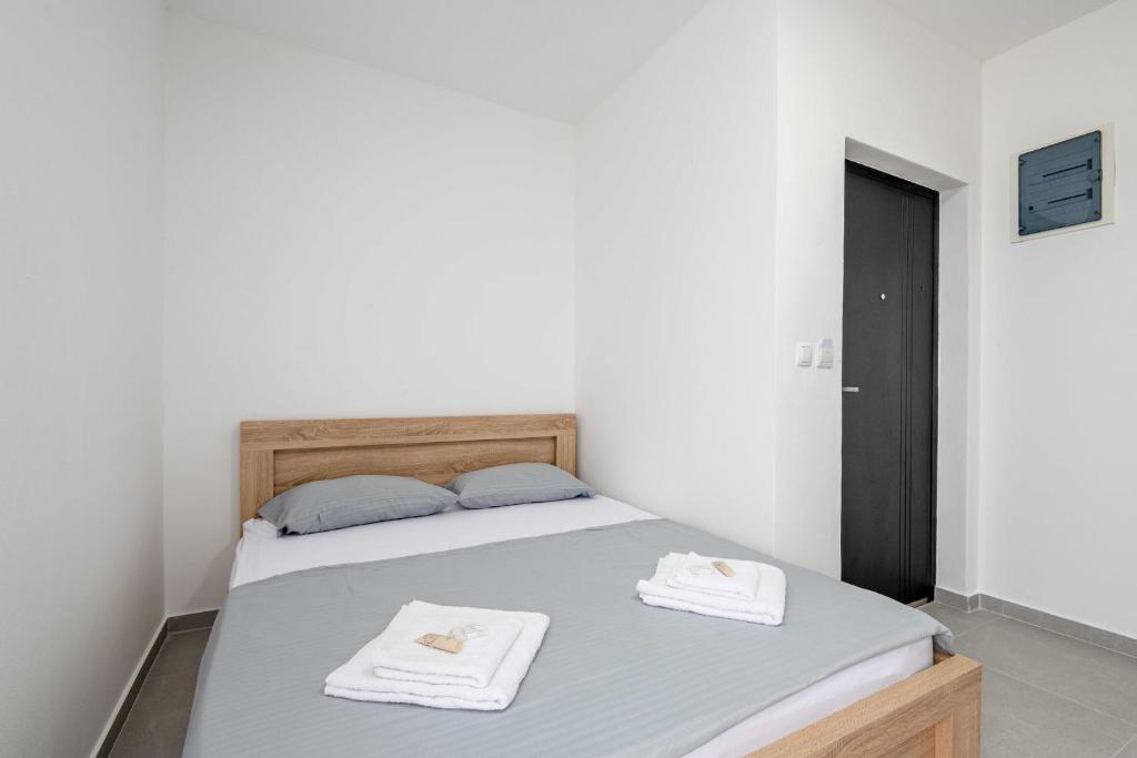 Postel nebo postele na pokoji v ubytování Apartments Milivojevic