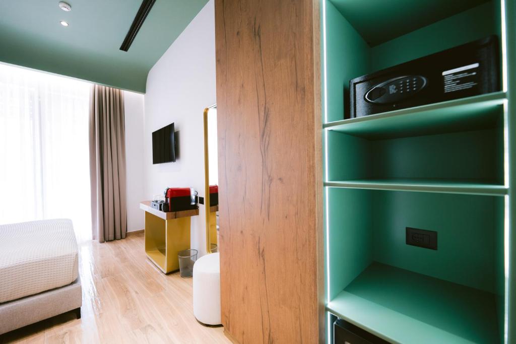 TV a/nebo společenská místnost v ubytování Noemie Hotel