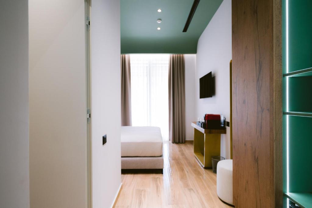 TV a/nebo společenská místnost v ubytování Noemie Hotel