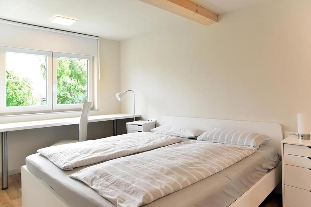 Postel nebo postele na pokoji v ubytování Ferienwohnung Spreebogen