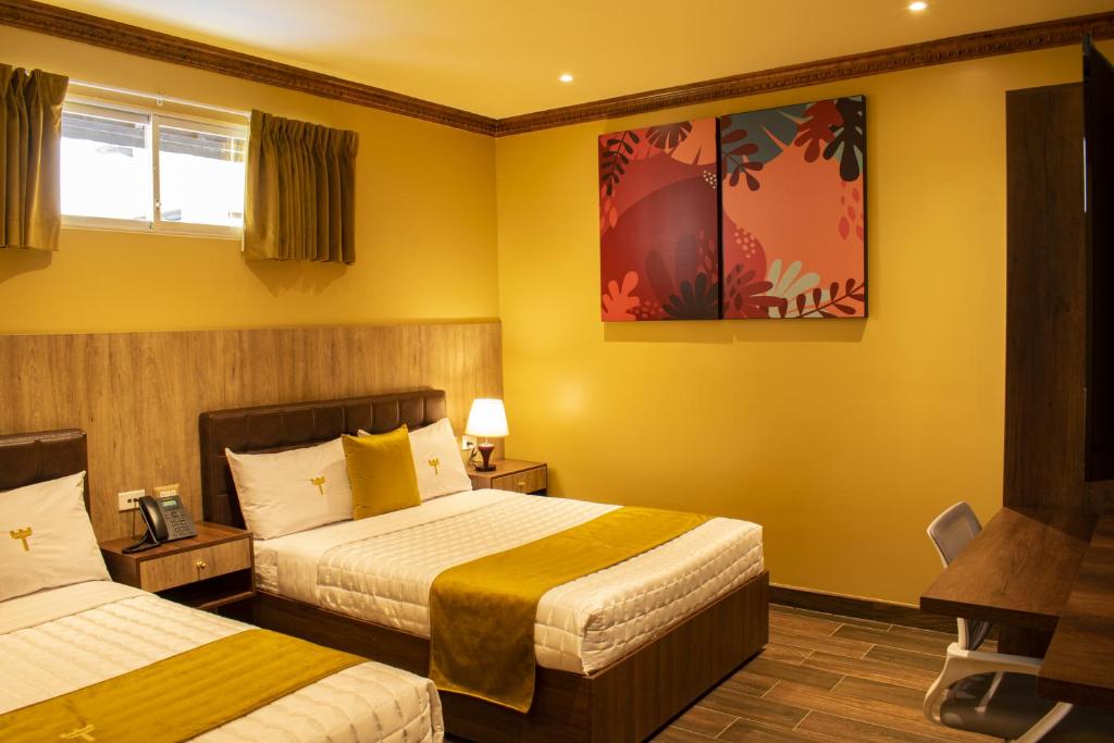 Postel nebo postele na pokoji v ubytování FORTICH APART HOTEL