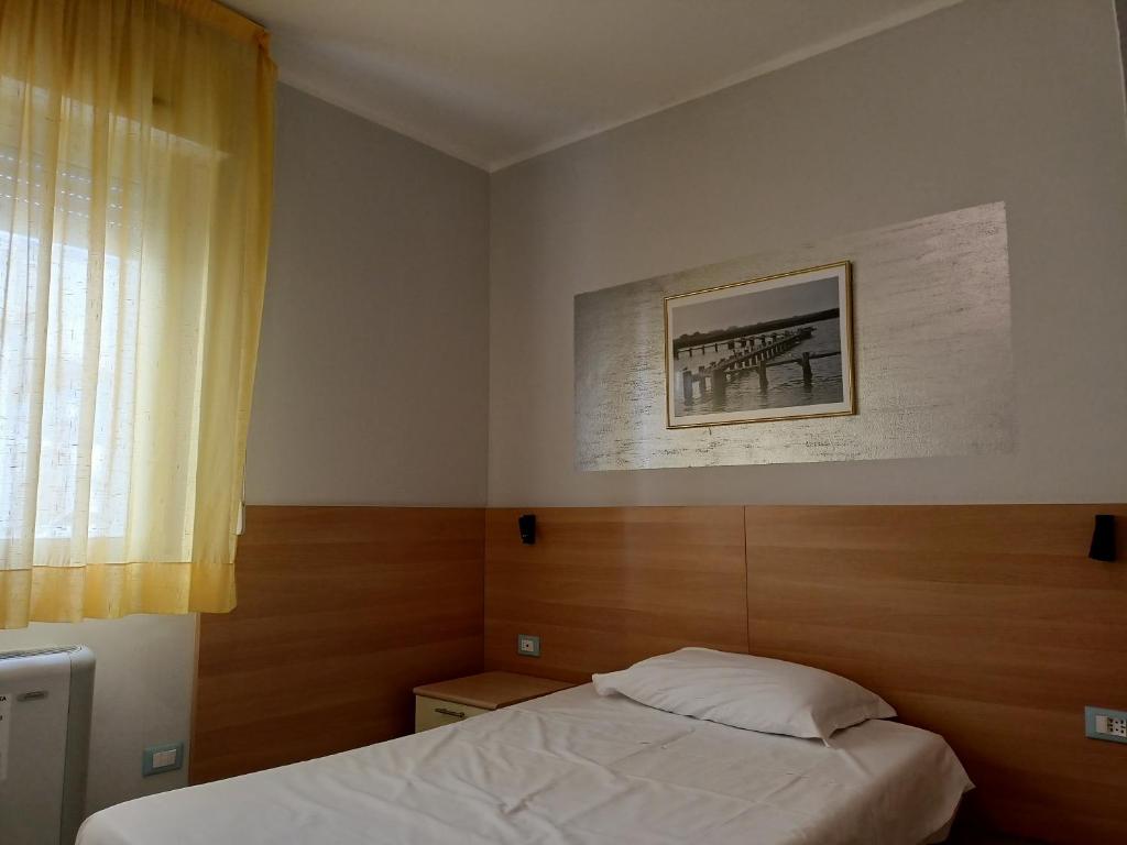 Postel nebo postele na pokoji v ubytování Hotel Ariston Imperial